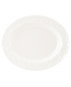An elegant white-on-white pattern, embossed vine motif and interior glaze adorn this oval serving platter from Lenox dinnerware. The dishes from the Opal Innocence Carved collection get your table set for refined dining every day. Qualifies for Rebate