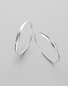 EXCLUSIVELY AT SAKS. Sophisticated hoops in polished sterling silver are subtly tapered from the middle. Sterling silver Diameter, about 2 Post back Imported