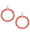 Amp up your wardrobe with a bold pop of color. Betsey Johnson's 80s-themed doorknocker earrings feature faceted red beads and crystal accents at the post. Approximate drop: 3 inches.