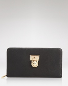 The Hamilton wallet captures the cosmopolitan essence of MICHAEL Michael Kors with its padlock design and sophisticated leather. The Hamilton wallet captures the cosmopolitan essence of MICHAEL Michael Kors with its padlock design and sophisticated leather.