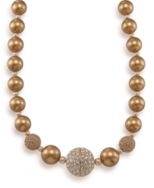 A vibrant gold graduated necklace is the perfect final touch. Created by Carolee, necklace features glass pearls and twinkling crystal fireballs. Crafted in 12k gold-plated mixed metal. Approximate length: 16 inches + 2-inch extender. A vibrant gold graduated necklace is the perfect final touch. Created by Carolee, necklace features glass pearls and twinkling crystal fireballs. Crafted in 12k gold-plated mixed metal. Approximate length: 16 inches + 2-inch extender.
