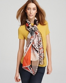 A sheer oblong scarf with smoldering hues in an abstract print. A sheer oblong scarf with smoldering hues in an abstract print.