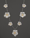 Delicate gardenias, captured at the height of their beauty in sterling silver and 18K yellow gold, bloom on this necklace from Buccellati.