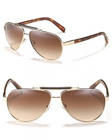 Represent summer chic in Prada's metal aviator sunglasses with a well stated top bar and tortoise arms. Represent summer chic in Prada's metal aviator sunglasses with a well stated top bar and tortoise arms.