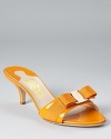 In festive, apricot-hued leather that looks fresh anytime of year, these patent sandals from Salvatore Ferragamo offer the brand's signature Italian style in a stylish and feminine package.