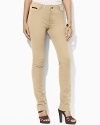 A sleek ankle-length pant is crafted in stretch cotton with a slim leg, creating a silhouette that flatters the figure.