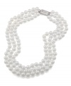 Perfect with an evening gown or a power suit, Carolee pearls enhance any look. Necklace features three rows of polished white glass pearls (8 mm) with a silver tone mixed metal clasp. Approximate length: 16 inches.