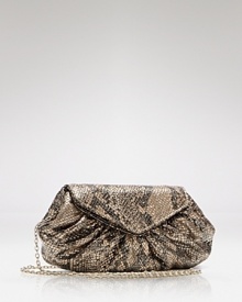 A slender strap snakes across your body, doubles over your shoulder or slithers off completely, giving Laura Merkin's cobra-embossed clutch tempting tactile appeal. A slender strap snakes across your body, doubles over your shoulder or slithers off completely, giving Laura Merkin's cobra-embossed clutch tempting tactile appeal.