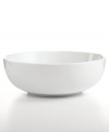 Purely casual and modern with its simple shape, this Whiteware round vegetable bowl adds a perfect, helpful accent to every gathering.