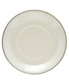 Wrapped in polished platinum bands, this simple tea saucer brings refined whimsy to your formal table in creamy fine bone china.