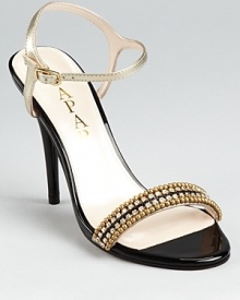 With vintage charm, these embellished Caparros evening sandals lend classic glamour.