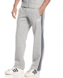 Whether you're ready to run or kick back and lounge, these fleece track pants from adidas will keep you at ease. Whether you're ready to run or kick back and lounge, these fleece track pants from adidas will keep you at ease.
