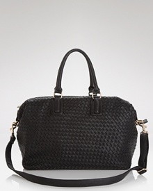 A tried-and-true travel bag with a textured twist. Crafted from woven PVC, this Cornelia Guest weekender is ready to carry on. A tried-and-true travel bag with a textured twist. Crafted from woven PVC, this Cornelia Guest weekender is ready to carry on.