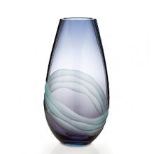 Featuring striking designs, dynamic shapes and dramatic color combinations – mouth blown and hand finished in the studios of Europe's foremost glass artisans – each Evolution piece is a one-of-a-kind example of high artistic vision, fashioned with expert technical dexterity and careful attention to detail from a vibrant palette of refined colors. Blending turquoise and purple to create a blissful shade of indigo, the Oasis collection is sure to infuse the home with a sense of calm, depth, and tranquility. Featuring striking designs, dynamic shapes and dramatic color combinations – mouth blown and hand finished in the studios of Europe's foremost glass artisans – each Evolution piece is a one-of-a-kind example of high artistic vision, fashioned with expert technical dexterity and careful attention to detail from a vibrant palette of refined colors. Blending turquoise and purple to create a blissful shade of indigo, the Oasis collection is sure to infuse the home with a sense of calm, depth, and tranquility.