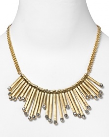 Strike gold with this plated bib necklace from Aqua, accented by angular bars and inset glass crystals. It's neo-tribal look demands to be worn with bold colors and prints.