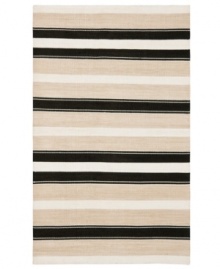 An ultra-modern design inspired by artisan flat weave carpets of Turkey and India, the Narragansett Stripe area rug from Lauren Ralph Lauren is woven by hand in India of luxurious banana silk with a hint of cotton.