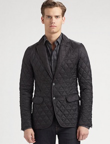 An all-weather update for a cornerstone of menswear style: the classic blazer in quilted nylon that offers a casual and sporty look for all climates. Two-button front Chest ticket pocket Waist flap pockets Suede elbow patches About 29 from shoulder to hem Polyamide Machine WashImported 