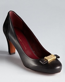 MARC BY MARC JACOBS suede backed pumps boast the brand's iconic logo plaque alongside a modern, streamlined bow.