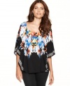 Bold ikat print gives way to chic black on Style&co.'s kimono-sleeve petite poncho top!