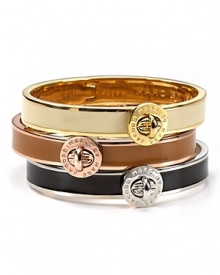 An elegant enameled bangle with a MARC BY MARC JACOBS logo turnlock closure.