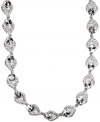 Scene-stealing sparkle! You'll be sure to turn heads in this glamorous, glittering collar necklace from Givenchy. With a dazzling array of glass accents and crystals, it's set in silver tone mixed metal. Approximate length: 16 inches + 3-inch extender.