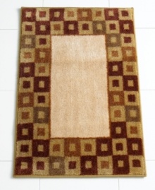 In plush cotton velour with a rich geometric motif, this decadently soft bath mat makes the canvas for very comfy feet.