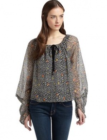 THE LOOKFloral and leaf printSemi-sheer designMetallic accentsDrawstring neckline with contrast tieContrasting keyhole detailLong sleeves with modified gathered effectTHE FITAbout 21 from shoulder to hemTHE MATERIALNylon/polyesterCARE & ORIGINHand washMade in USAModel shown is 5'9 (175cm) wearing US size Small. 