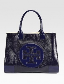 Textured patent leather in contrasting tones forms this roomy carryall, with a signature front emblem and plush wool lining. Double top handles, 7½ dropOpen topWool lining17W X 14H X 5½DImported Textured patent leather in contrasting tones forms this roomy carryall, with a signature front emblem and plush wool lining. Double top handles, 7½ dropOpen topWool lining17W X 14H X 5½DImported