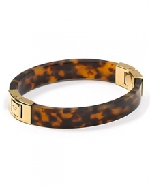 Classic cool. Wear MICHAEL Michael Kors' gold-hinged bangle to add burnished warmth to fall's cool looks.