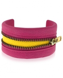 Peek-a-boo! BCBGeneration's whimsical cuff bracelet features a zipper in the center that reveals a yellow accent underneath for a vibrant touch. Crafted in PVC.  Approximate length: 8 inches.