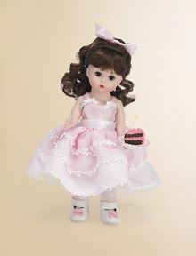 This pretty brunette miss brings birthday wishes to a lucky young lady on her special day.8 cloth dollDressed in a pink, full-skirted frock with floral embroidery and white Mary Jane slippersShe offers a luscious-looking slice of birthday cakeRecommended for ages 3 and upImported