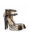 Finish your look with a note of hard-edge elegance in Valentinos eye-catching zebra printed peep-toe pumps, complete with iconic rockstud trim - Double buckled ankle straps - Pair with sharply tailored separates or chic cocktail dresses