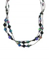 For the daring fashionista. Multiple strands of iridescent aurora borealis beads and jet black lantern beads dazzle on this eye-catching hematite-plated mixed metal necklace by 2028. Approximate length: 16 inches + 3-inch extender.