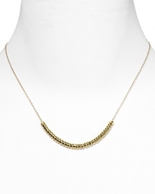 Vanessa Mooney takes the basic beaded necklace downtown with striking gold-plated stations. Follow the style set and wear yours layered beneath jersey basics.