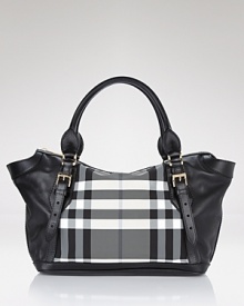 A bold black and white check panel lends statement style to this go-anywhere tote from Burberry. A bold black and white check panel lends statement style to this go-anywhere tote from Burberry.