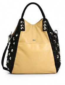 THE LOOKRemovable flat leather crossbody strapDouble tubular leather top handles with whipstitchingNickel cone studs dot the side panelsMagnetic snap closureFront metal logo detailOne outside open pocketOne inside zip pocketTwo inside open pocketsInside logo detailTHE MEASUREMENTCrossbody strap, 19 drop18W X 14H X 4DTHE MATERIALLeatherUltra suede liningORIGINMade in USA THE LOOKRemovable flat leather crossbody strapDouble tubular leather top handles with whipstitchingNickel cone studs dot the side panelsMagnetic snap closureFront metal logo detailOne outside open pocketOne inside zip pocketTwo inside open pocketsInside logo detailTHE MEASUREMENTCrossbody strap, 19 drop18W X 14H X 4DTHE MATERIALLeatherUltra suede liningORIGINMade in USA
