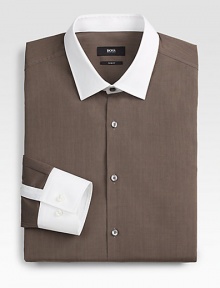 Not your basic solid dress shirt, this tailored classic of crisp, slim-fitting cotton, is accented with contrasting collar and cuff for a modern update.Button-frontPoint collarCottonMachine washImported