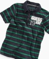 Prepster style meets denim heritage in this vintage-themed polo from GUESS: Front logo patches feature the number 19 while back logo reads 81 to proclaim the company's founding in 1981.