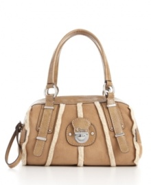Faux shearling, real style: the soft, boxy Larchmonte satchel features faux suede and shearling trim for a look that's chic apres-ski or in the city. Faux shearling, real style: the soft, boxy Larchmonte satchel features faux suede and shearling trim for a look that's chic apres-ski or in the city.