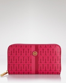 Tory Burch puts a bold spin on practical style with this logo-printed wallet. In durable coated canvas with room for the essentials, it's a modern girl's must have. Tory Burch puts a bold spin on practical style with this logo-printed wallet. In durable coated canvas with room for the essentials, it's a modern girl's must have.