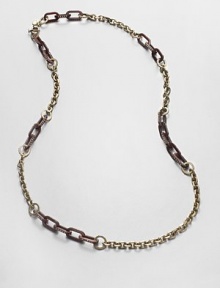 A chic piece with pavé stones on glossy plastic and shiny metal links. Glass stonesBrassEpoxyLength, about 16.4Spring ring closureImported A chic piece with pavé stones on glossy plastic and shiny metal links. Glass stonesBrassEpoxyLength, about 16.4Spring ring closureImported