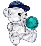 What a catch! Kris Bear is all suited up for little league, wearing a blue baseball hat in this crystal figurine for Swarovski collectors.