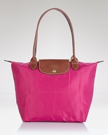 A timeless and durable nod to French style, Longchamp's nylon tote perfects daily errand-running for the très chic girl about town. A timeless and durable nod to French style, Longchamp's nylon tote perfects daily errand-running for the très chic girl about town.