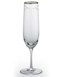 Commemorate a special anniversary with a simply elegant reminder of the time you said, I do. This radiant crystal flute is hand-engraved with interlocking bands that symbolize the rings exchanged between bride and groom. A platinum rim provides a graceful finish. Commemorate a special anniversary with a simply elegant reminder of the time you said, I do. This radiant crystal flute is hand-engraved with interlocking bands that symbolize the rings exchanged between bride and groom. A platinum rim provides a graceful finish.