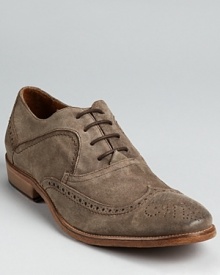 Weathered suede and classic wingtip perforation details complete this beautifully rendered oxford from John Varvatos. Weathered suede and classic wingtip perforation details complete this beautifully rendered oxford from John Varvatos.