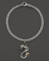 18K yellow gold accents this hand-crafted sterling silver dragon charm bracelet from John Hardy's Naga collection. Exclusive to Bloomingdale's.