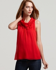 In layers of sheer chiffon with a feminine ruffled neckline, this T Tahari blouse makes an undeniable statement in a showstopping color. In layers of sheer chiffon with a feminine ruffled neckline, this T Tahari blouse makes an undeniable statement in a showstopping color.