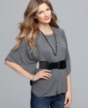 Dramatic sleeves and a soft drape contrast with a whittled waist in Cha Cha Vente's stylish top.