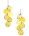 Get an added dose of Vitamin-D! Kenneth Cole New York's punch-bright earrings feature yellow resin circles accented by sparkling crystals. Set in hematite plated mixed metal. Approximate drop: 2-3/8 inches.