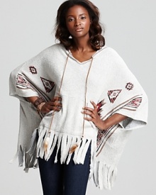 Ingeniously rendered in plush terry, this Vintage Havana hooded poncho spices up your casual wardrobe with a colorful Aztec print, fringed hem and feather detail. Ingeniously rendered in plush terry, this Vintage Havana hooded poncho spices up your casual wardrobe with a colorful Aztec print, fringed hem and feather detail.